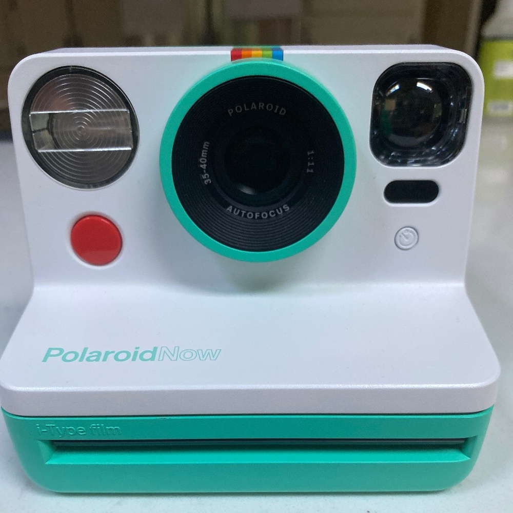 Teal Polaroid camera no film